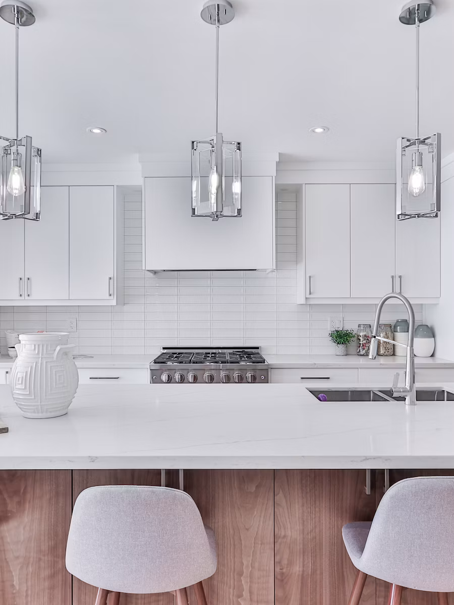 White farmhouse kitchen with pendant lighting